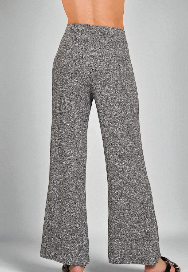 Gray flared pants on a gray background