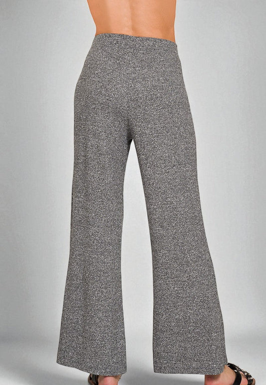 Gray flared pants on a gray background