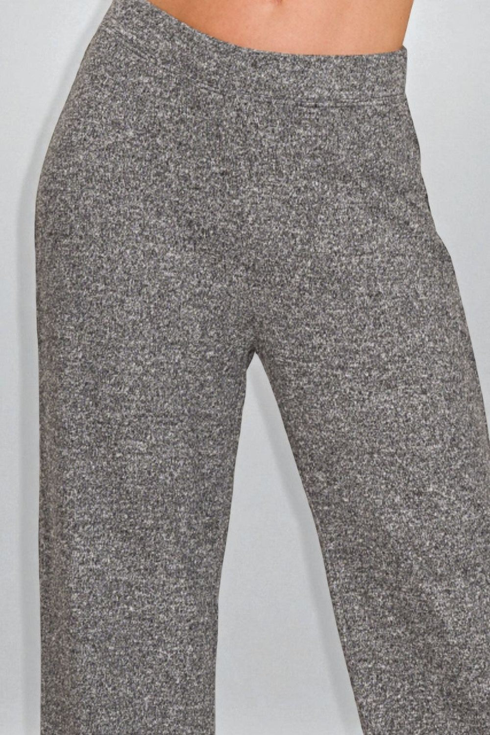 Gray textured pants on a light gray background