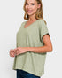 Woman wearing a green t-shirt against a white background