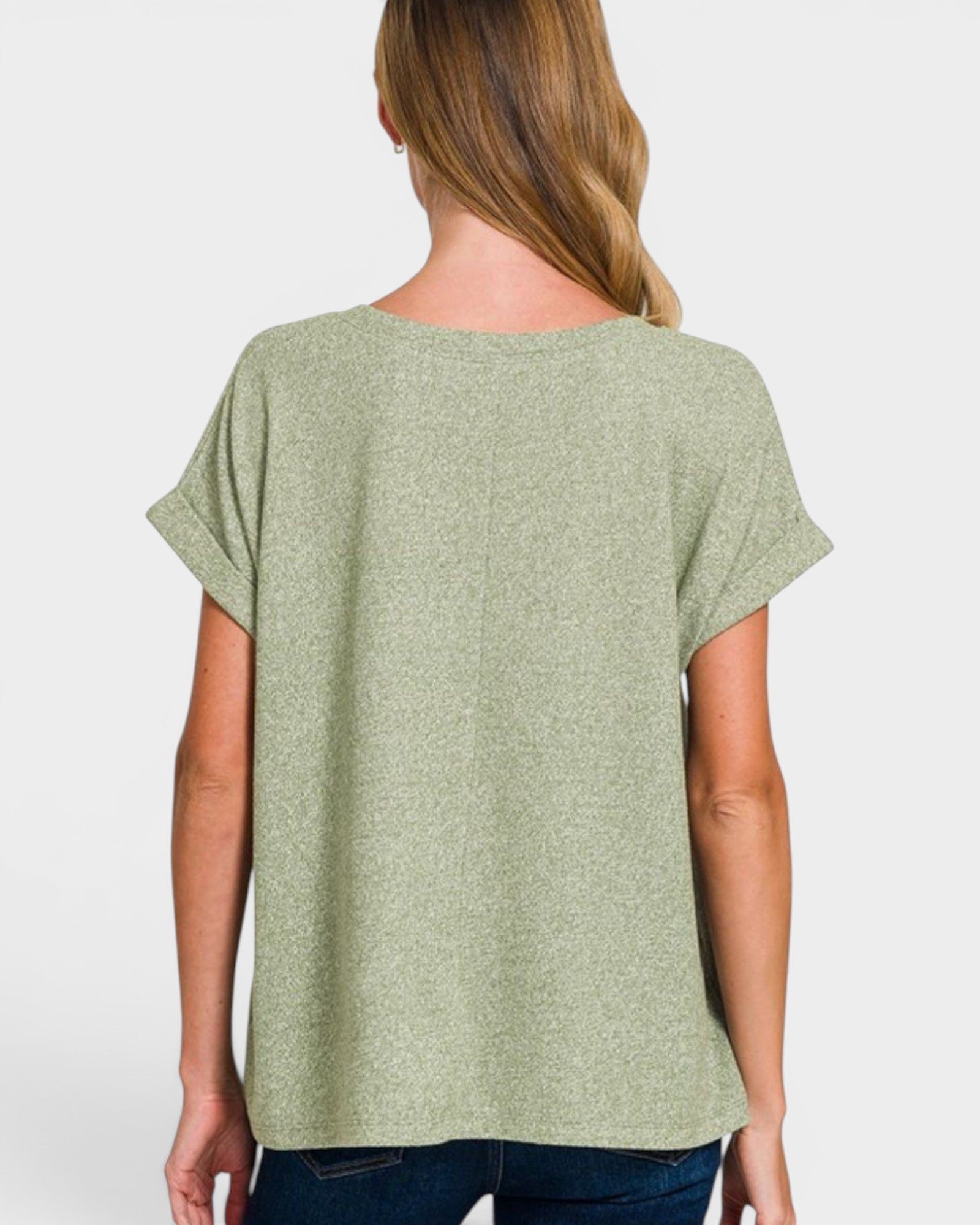 Woman wearing a green t-shirt on a white background