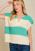 Woman wearing a sleeveless knitted top with green and beige stripes on a plain background