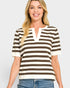 Woman wearing a brown and white striped shirt with a plain background
