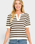 Woman wearing a brown and white striped shirt with a plain background