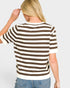 Person wearing a brown and white striped shirt on a plain background