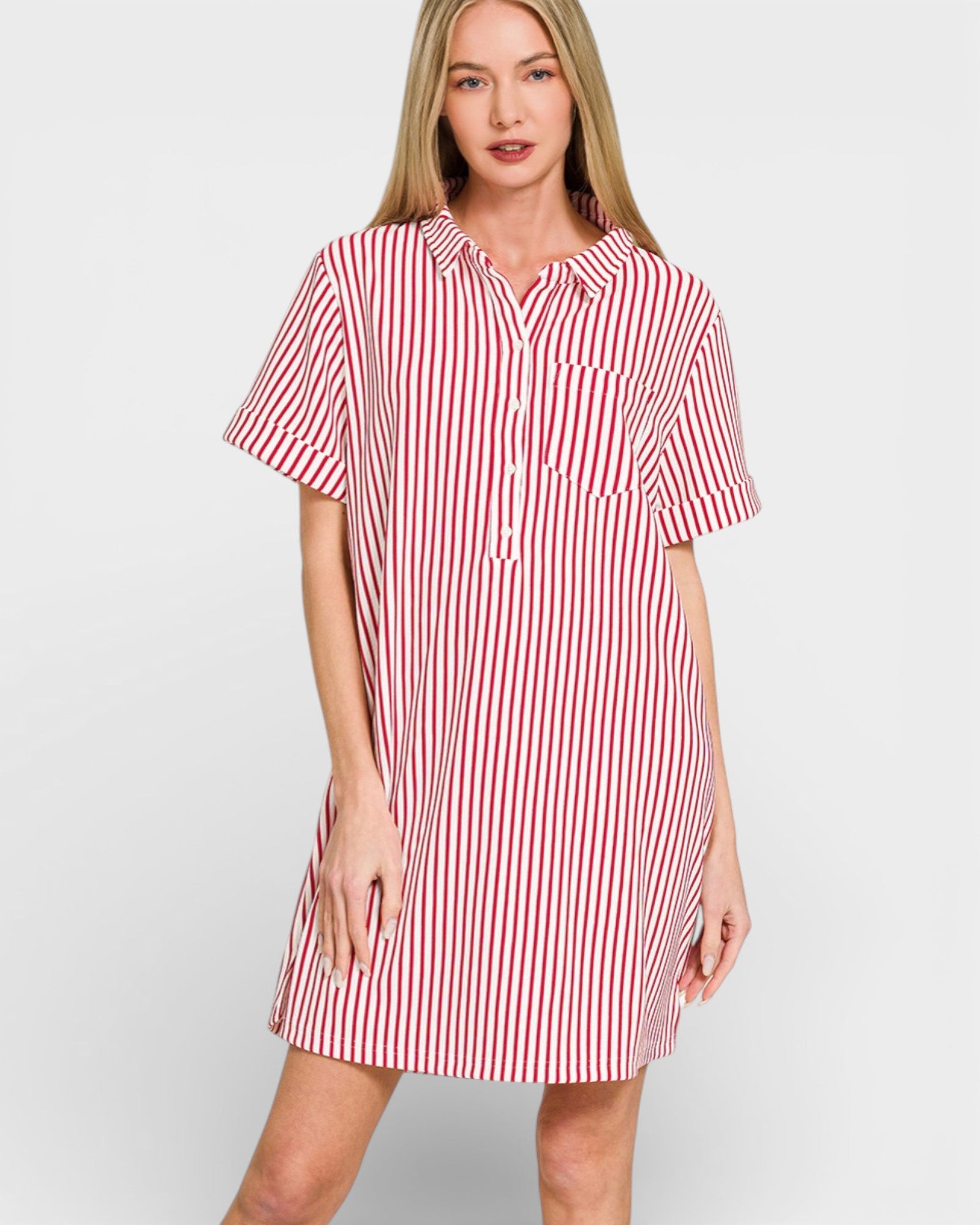 Woman wearing a red and white striped shirt dress on a white background