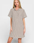 Woman wearing a striped shirt dress on a white background