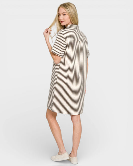 Woman wearing a striped dress on a white background