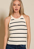 Woman wearing a striped tank top against a beige background