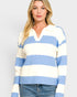 Woman wearing a blue and white striped sweater on a plain background