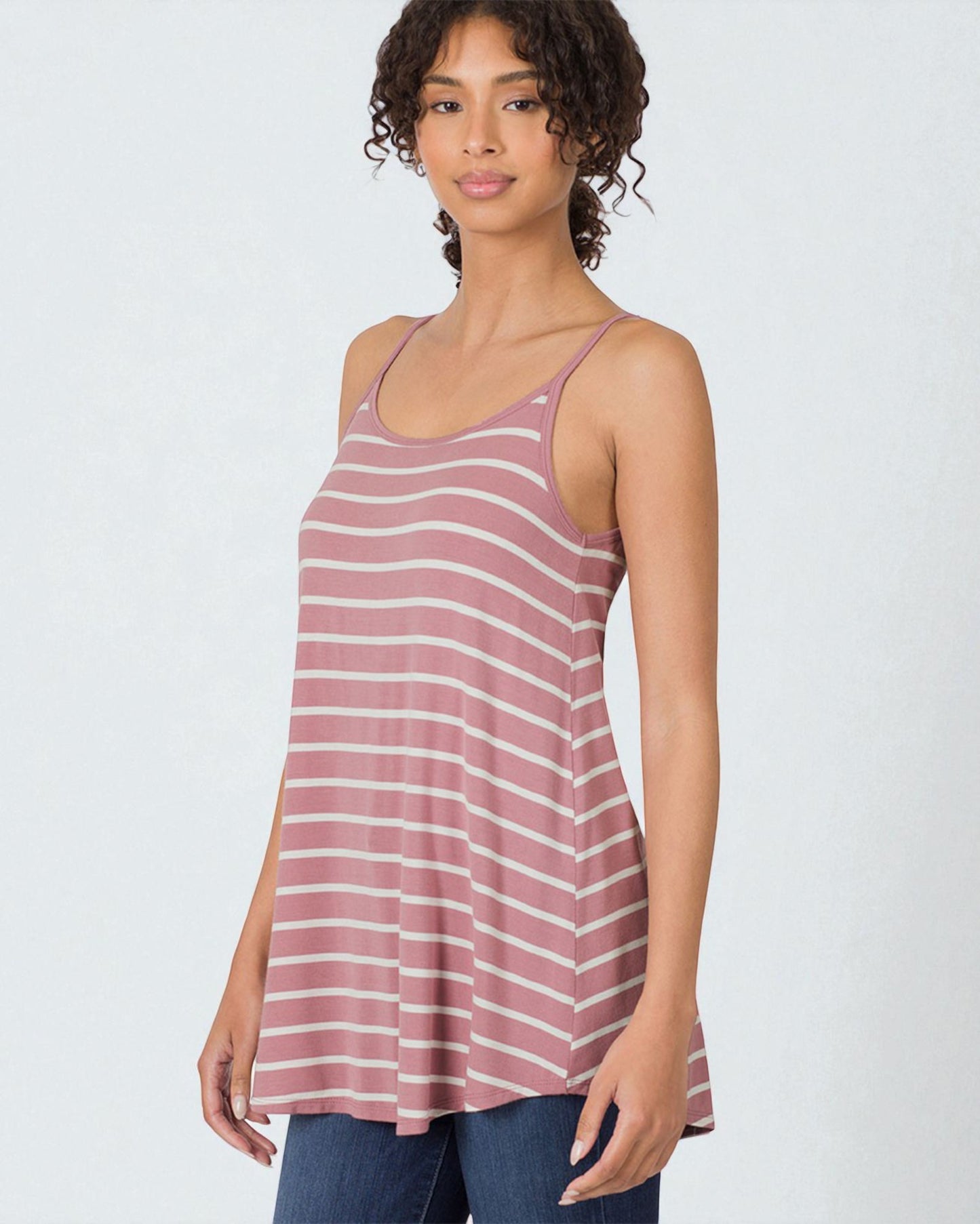 Woman wearing a striped tank top on a white background