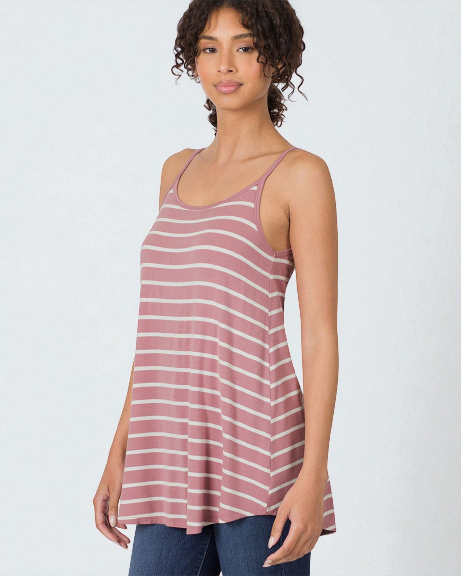 Woman wearing a striped tank top on a white background