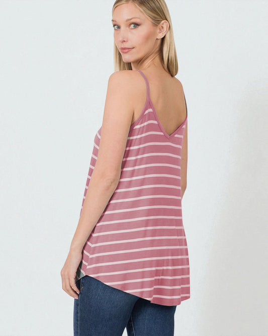 Woman wearing a pink and white striped tank top against a white background
