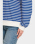 Blue and white striped long-sleeve shirt with jeans on a white background