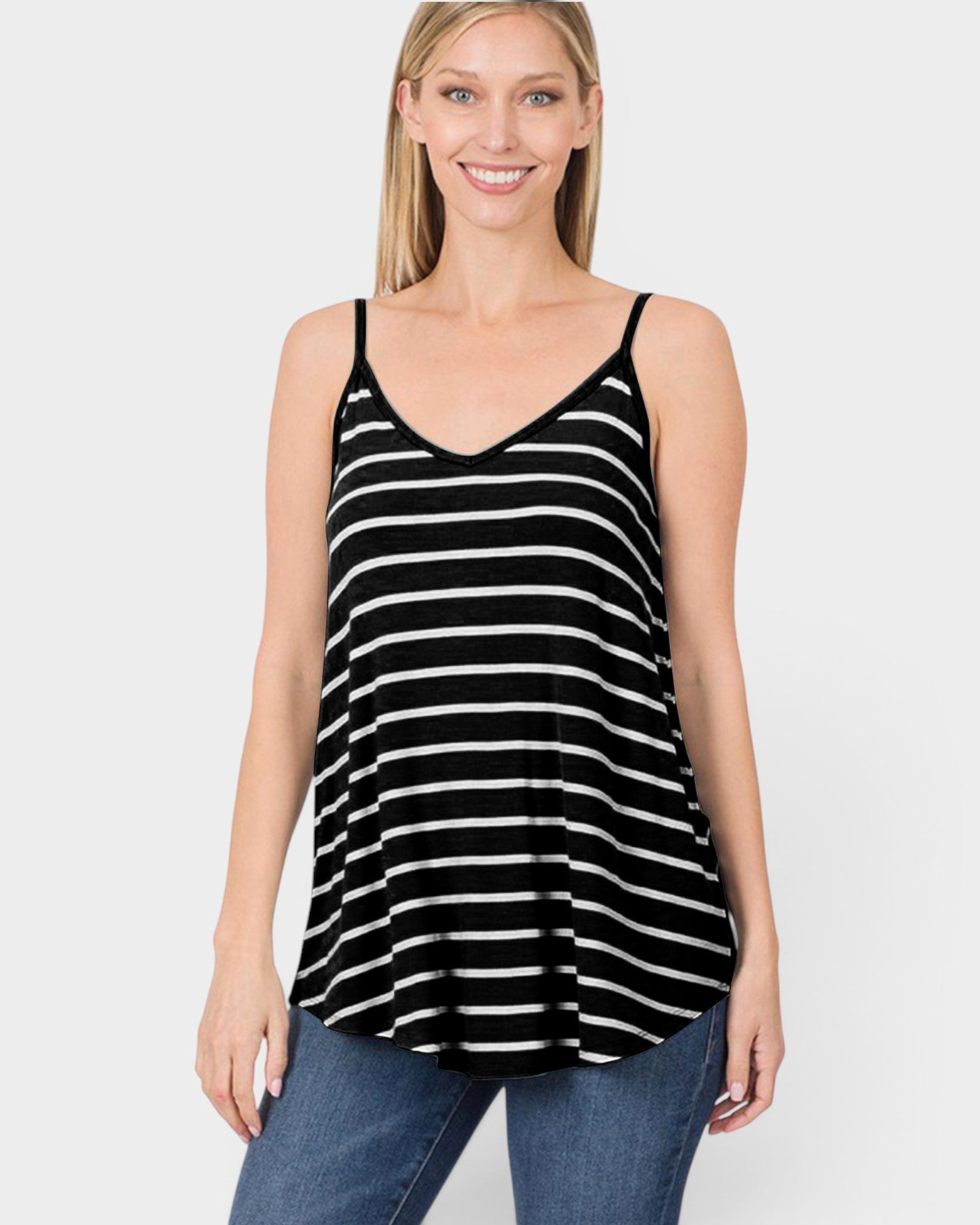 Woman wearing a black and white striped tank top on a white background