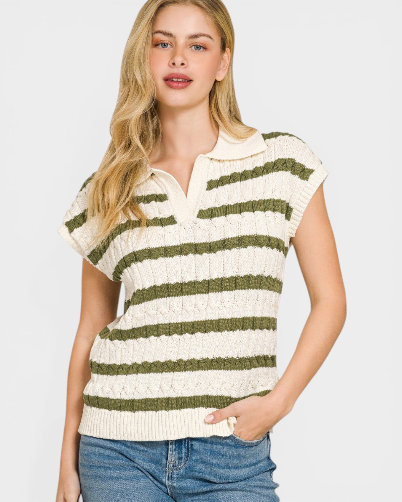 Woman wearing a striped short-sleeve top with a plain background
