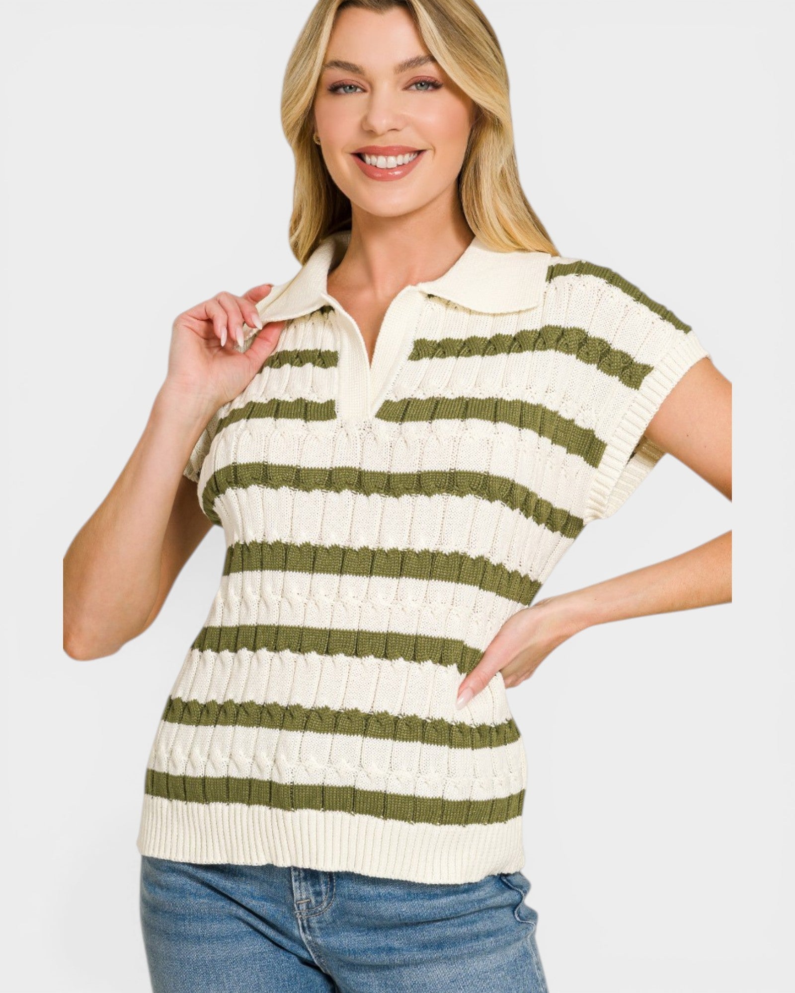 Woman wearing a green and white striped shirt on a plain background