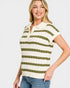 Woman wearing a green and white striped short-sleeve sweater on a plain background