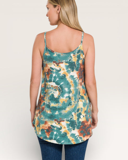 Woman wearing a tie-dye tank top with a neutral background