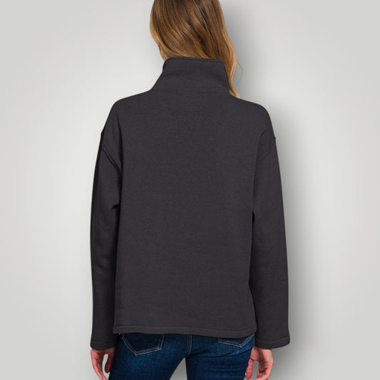 Person wearing a dark gray jacket on a white background