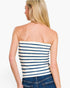 A woman shown from the back wearing a strapless knit top with horizontal navy and off-white stripes, paired with blue jeans, against a plain white studio background.