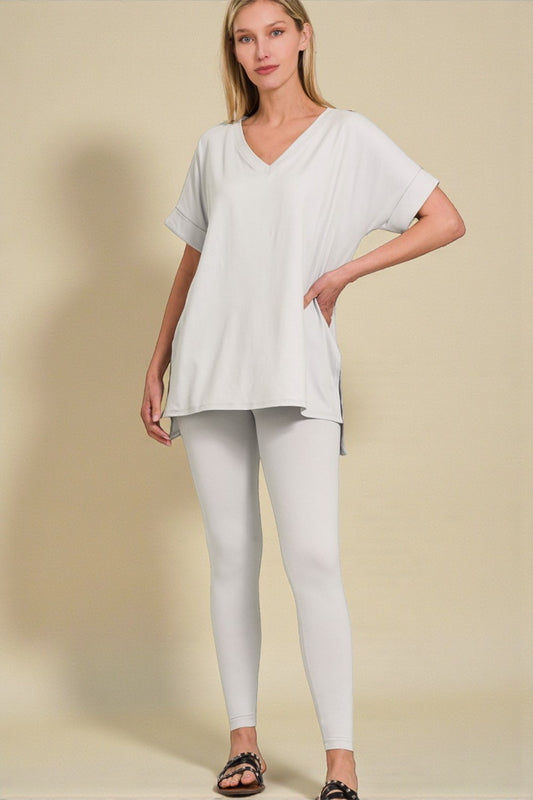 Woman wearing a white outfit on a beige background