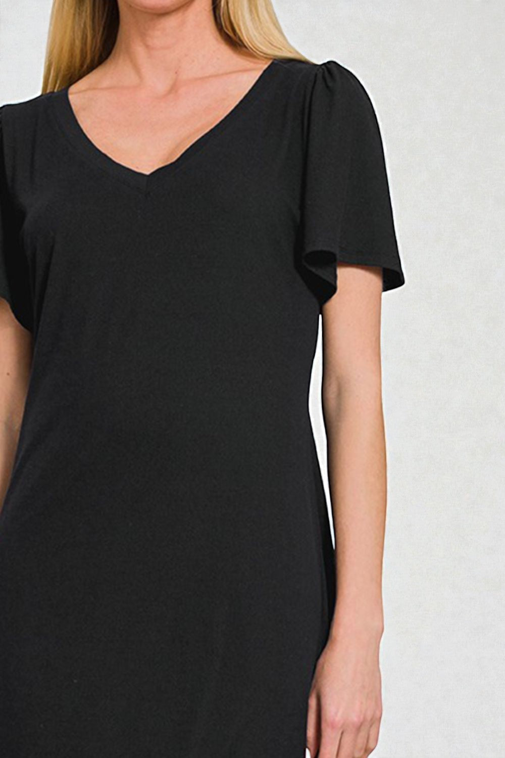 Black dress with short sleeves on a white background