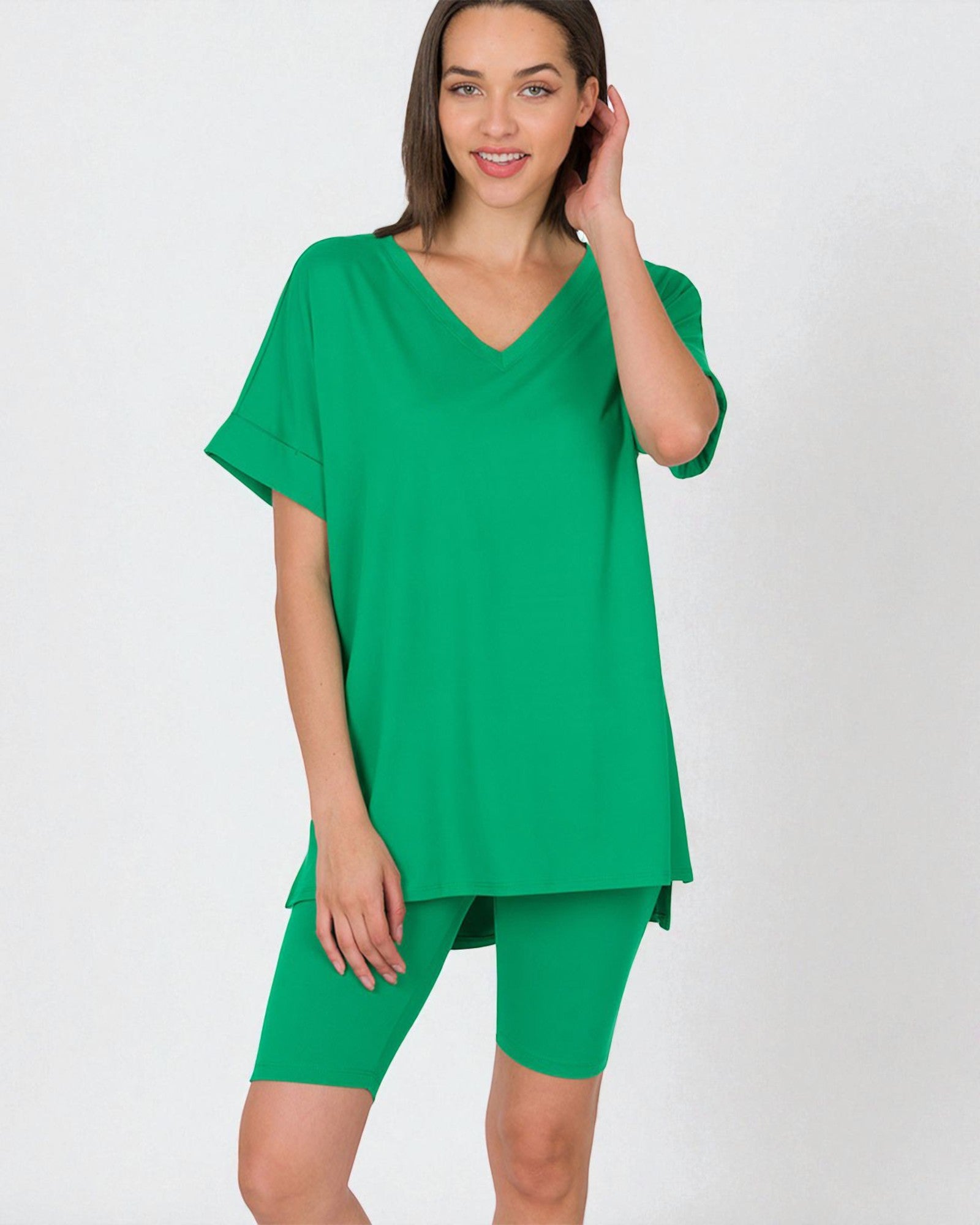 Woman wearing a green outfit on a white background