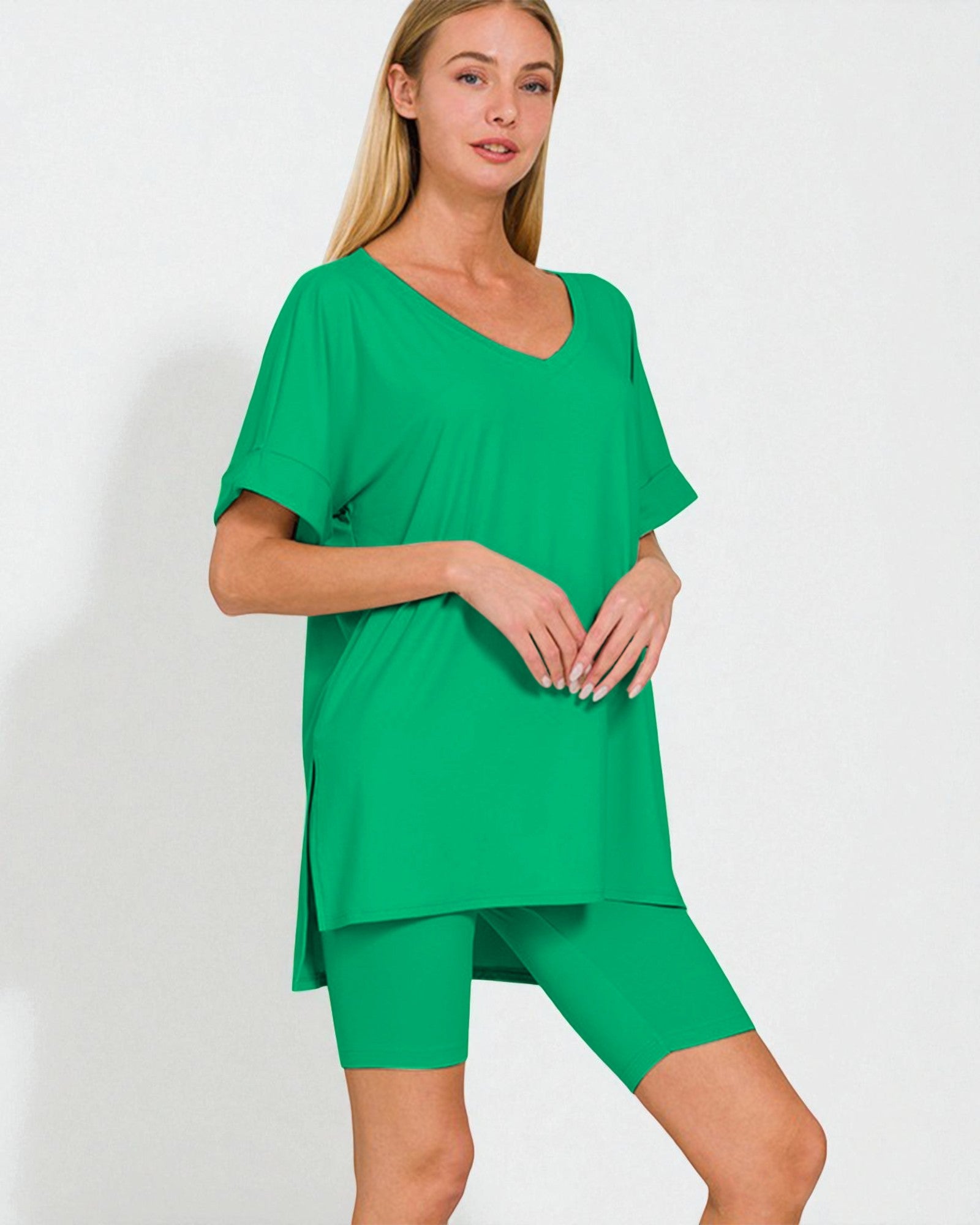 Woman wearing a green outfit on a white background