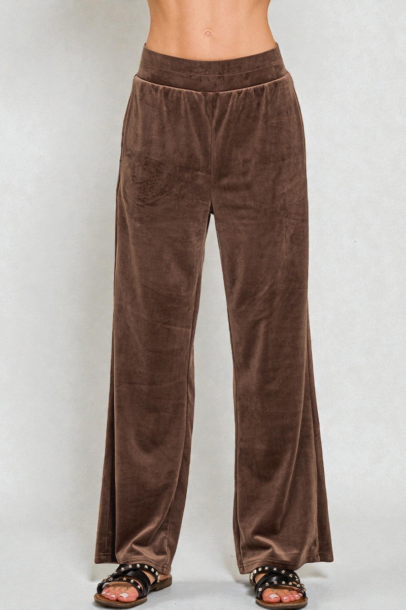 Brown velvet pants on a white background