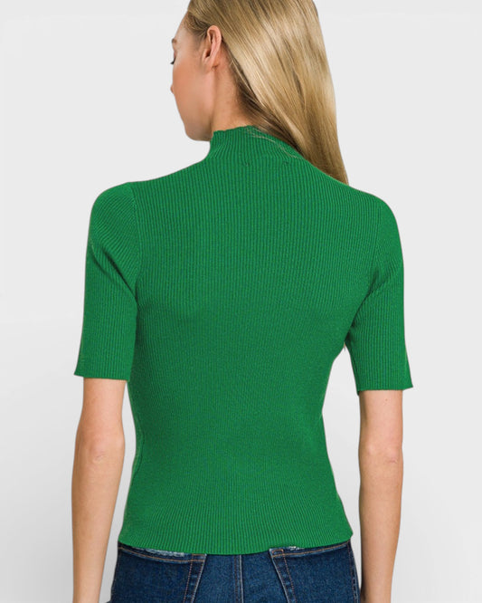 Person wearing a green ribbed top on a plain background
