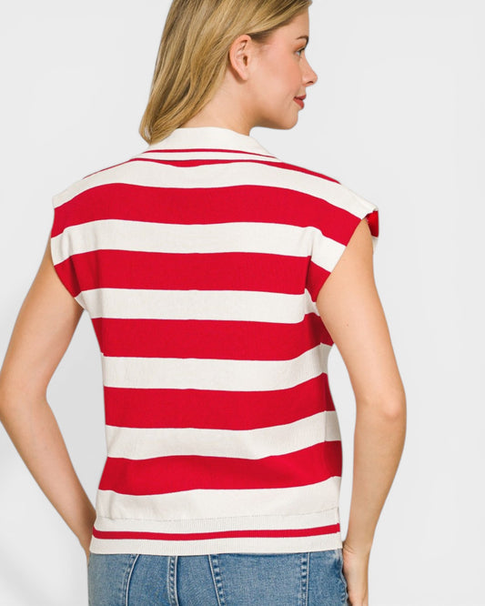 Woman wearing a red and white striped shirt on a plain background