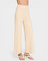 Beige wide-leg pants worn by a person on a white background