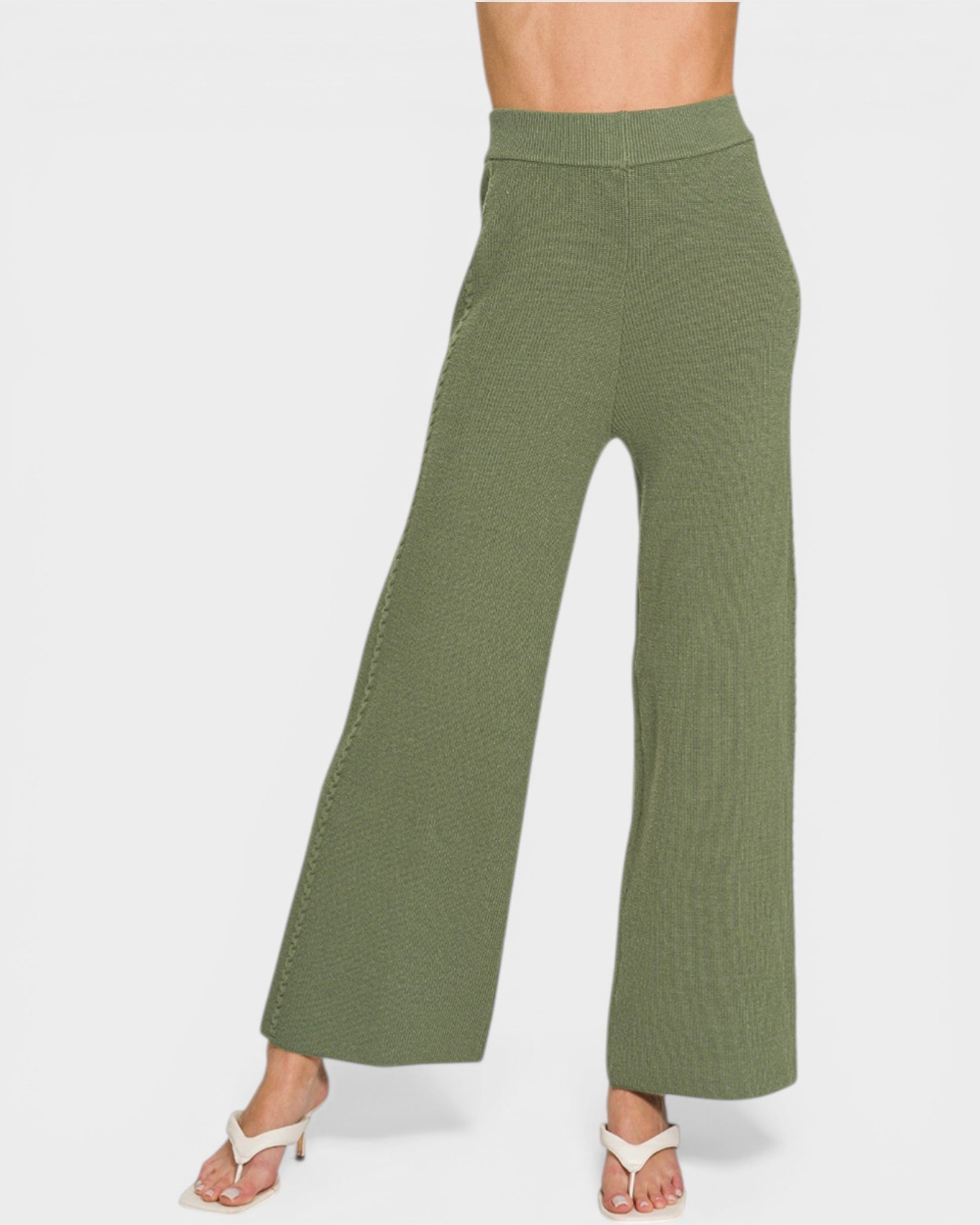 Green wide-leg pants on a white background