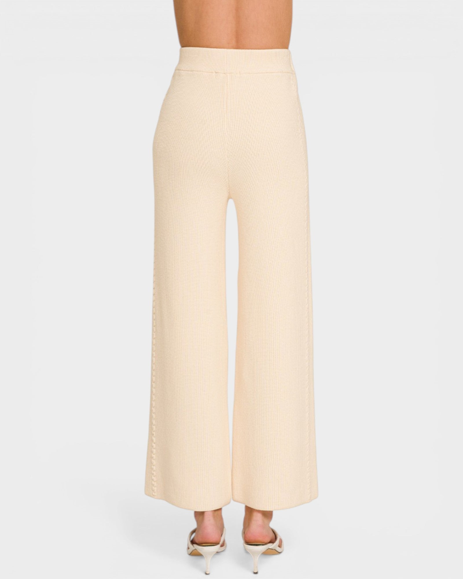 Beige wide-leg pants on a white background