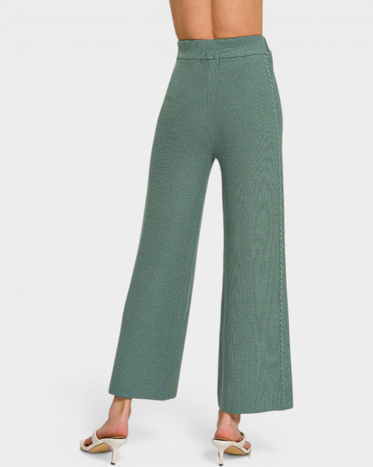 Green wide-leg pants on a white background