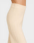 Beige ribbed leggings worn by a person on a light gray background