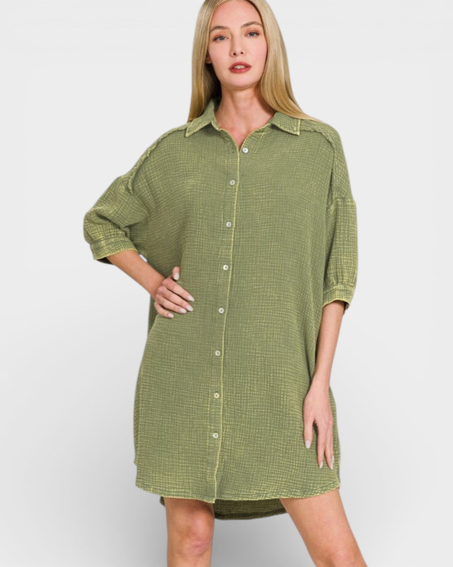 Woman wearing a green checkered dress against a white background