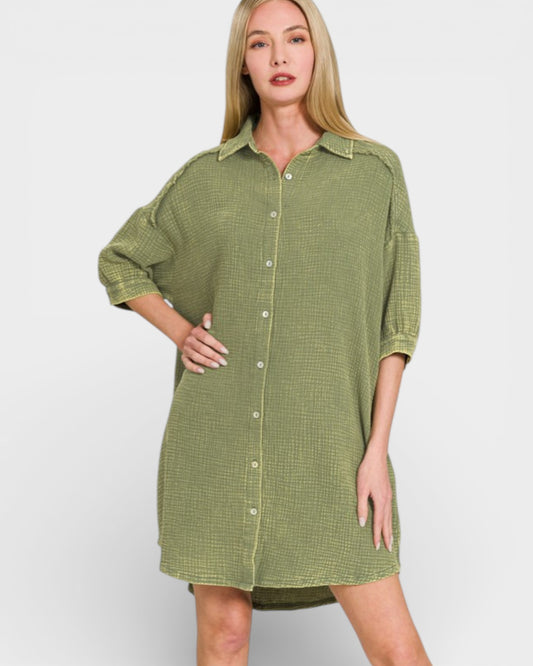 Woman wearing a green checkered dress against a white background