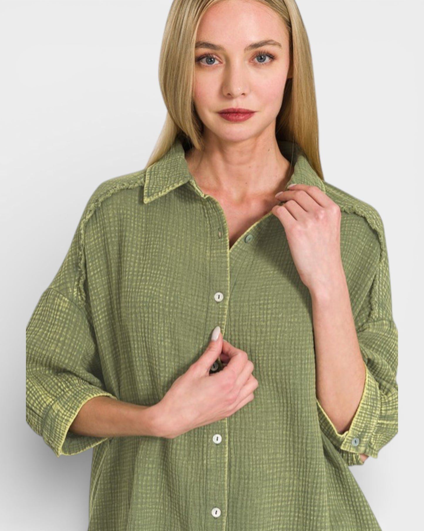Woman wearing a green checkered shirt against a white background