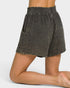 Textured shorts worn by a person on a plain background
