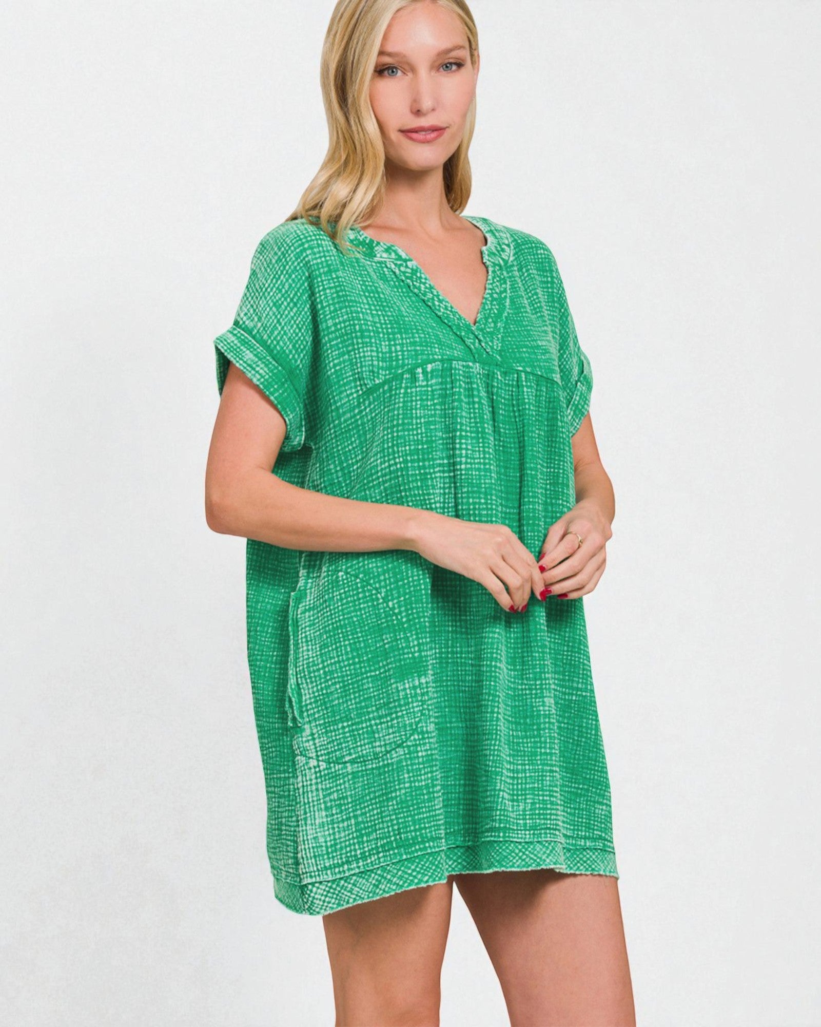 Woman wearing a green dress against a white background