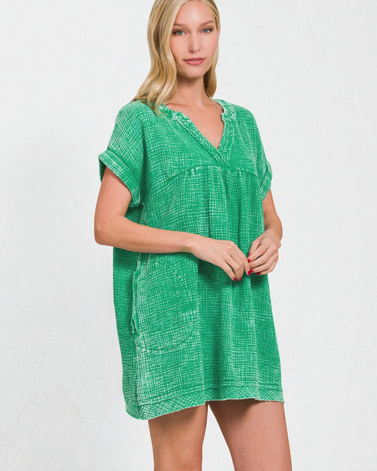 Woman wearing a green dress against a white background