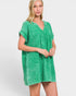 Woman wearing a green dress on a white background