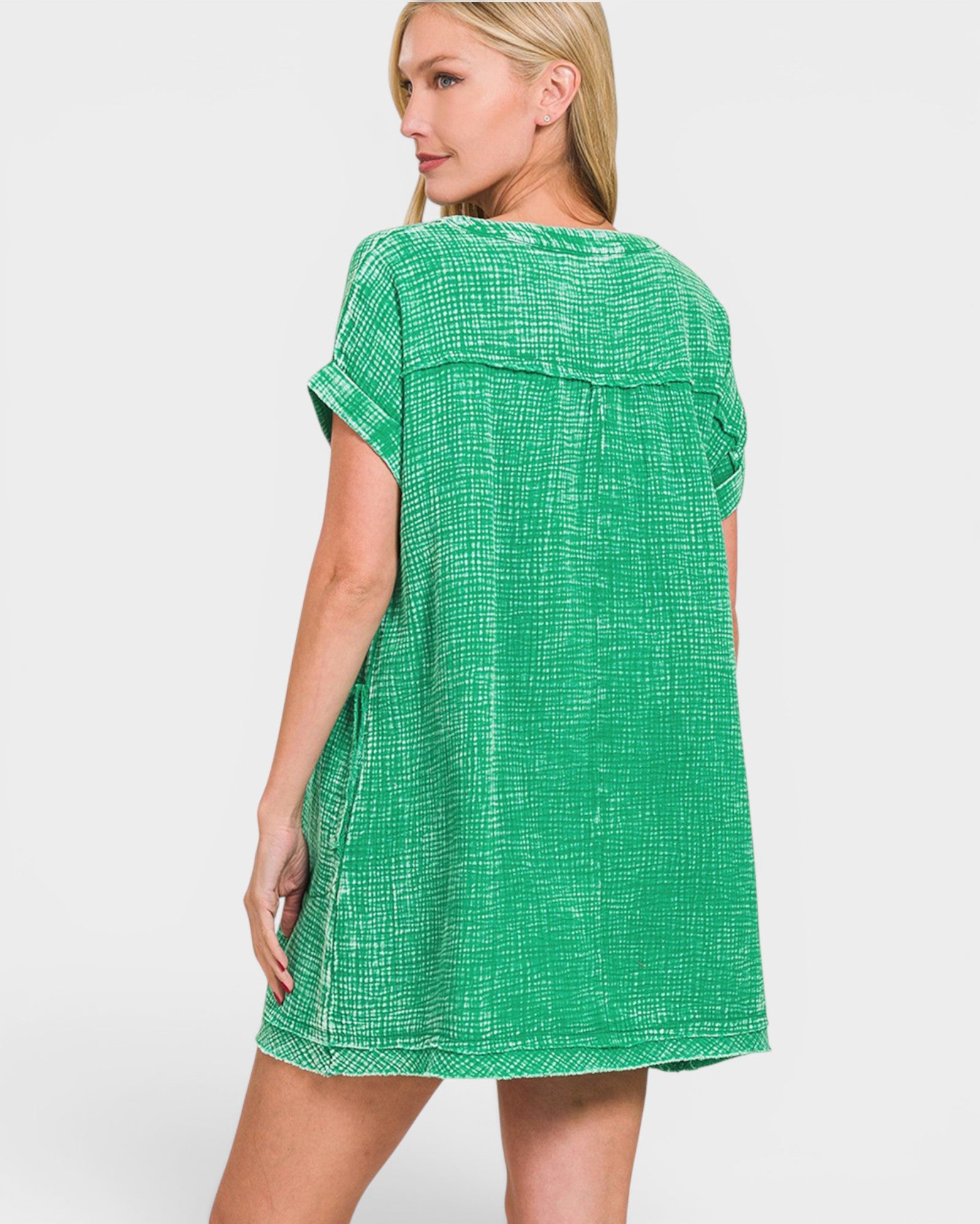 Woman wearing a green dress on a white background
