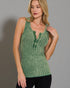 Woman wearing a green ribbed tank top against a gray background