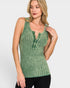 Woman wearing a green ribbed tank top with button details on a white background