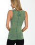 Woman wearing a green sleeveless top with a logo on a white background