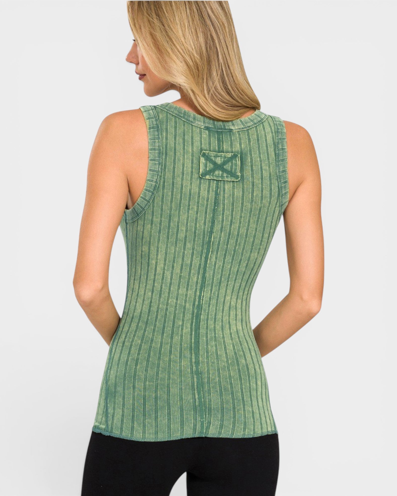 Green ribbed tank top with a logo on the back worn by a person against a white background