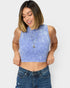 Woman wearing a blue striped crop top and jeans on a white background